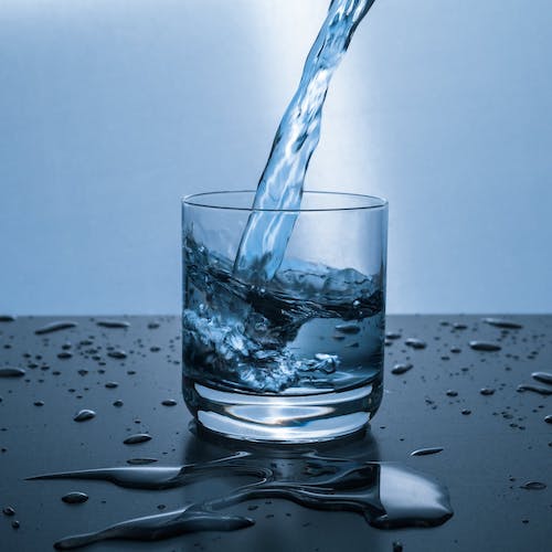Pouring water in a glass