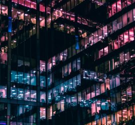 View of lit business office windows night