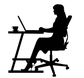 Silhouette of a woman working at a desk