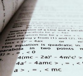 Close-up of math equations printed in a book