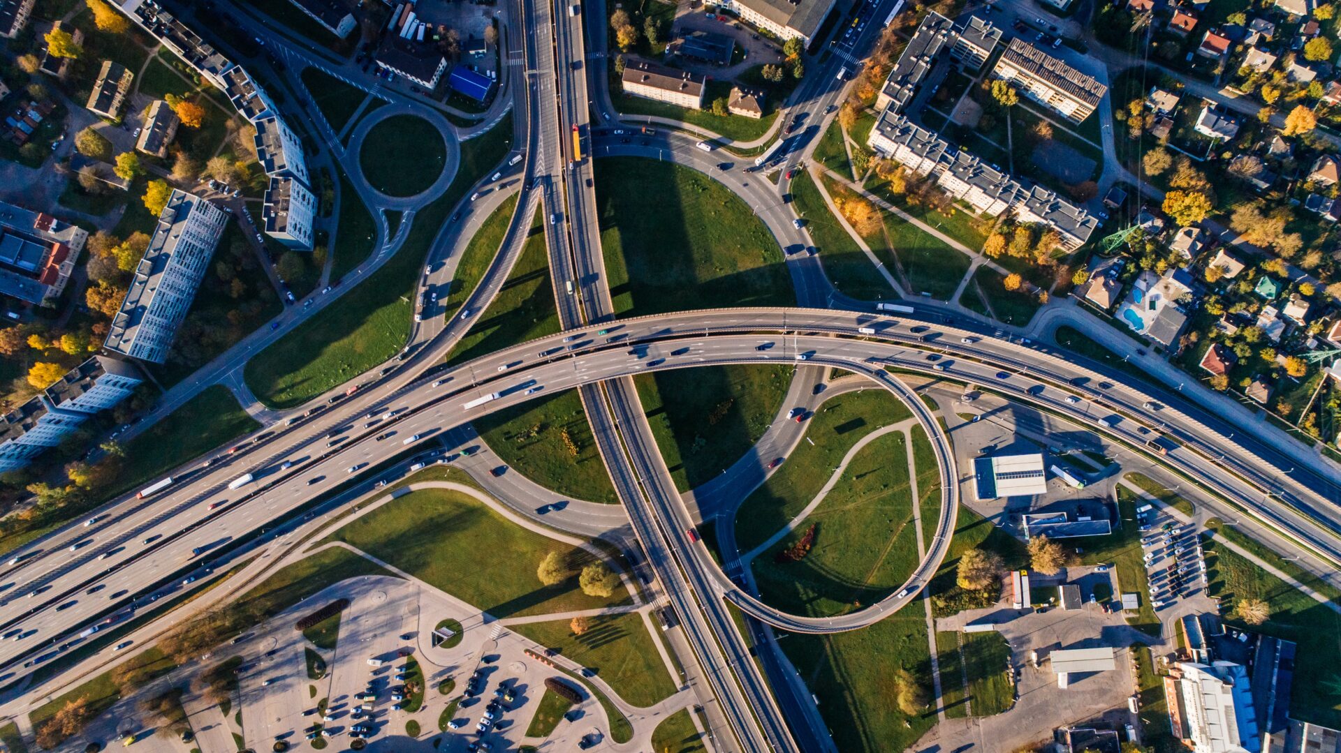 Aerial view of a multi-level highway interchange with traffic.